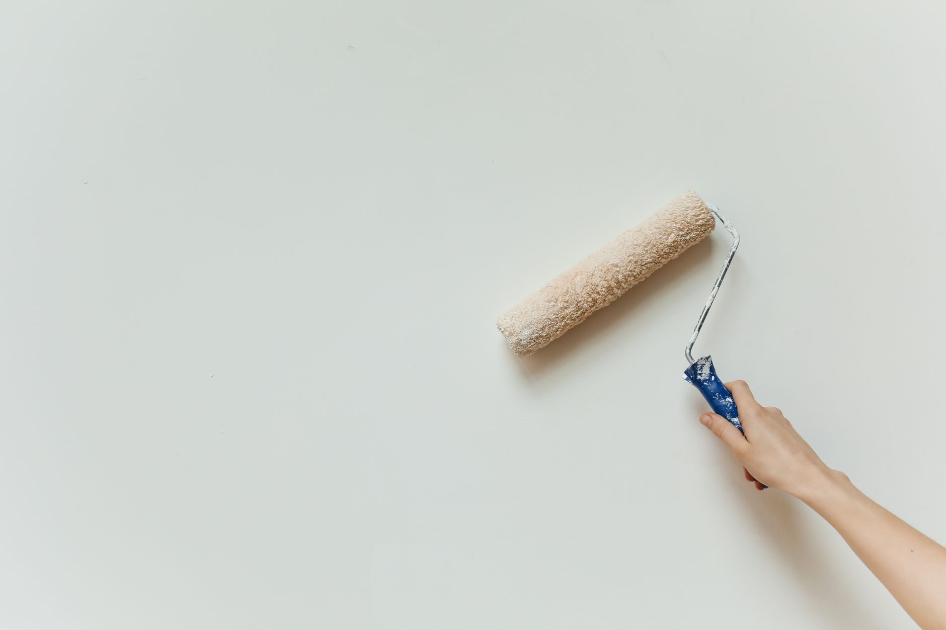 a person painting a wall